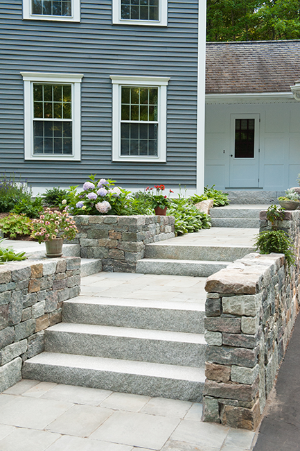 Granite stairs for a Bedford home by Stone Blossom Landscape and Design, LLC