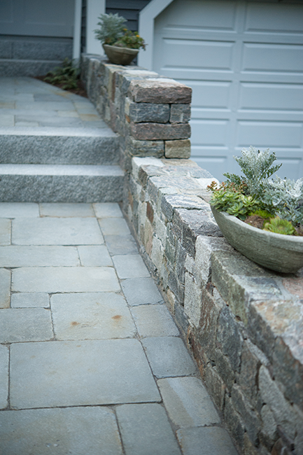 Stone wall and bluestone walkway for a Bedford NH landscape design
