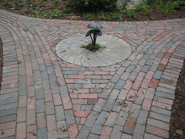 Garden walkway made from brick pavers by Stone Blossom