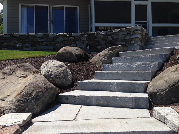 Granite Steps and stone wall in the lakes region of NH installed by Stone Blossom