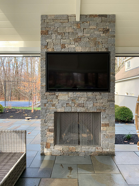 Bedford Outdoor TV and Fireplace by Stone Blossom